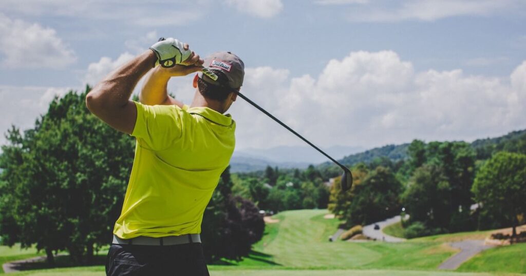 A golfer demonstrating how to hit a draw in golf